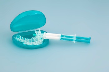 Teal translucent whitening gel applicator and trays