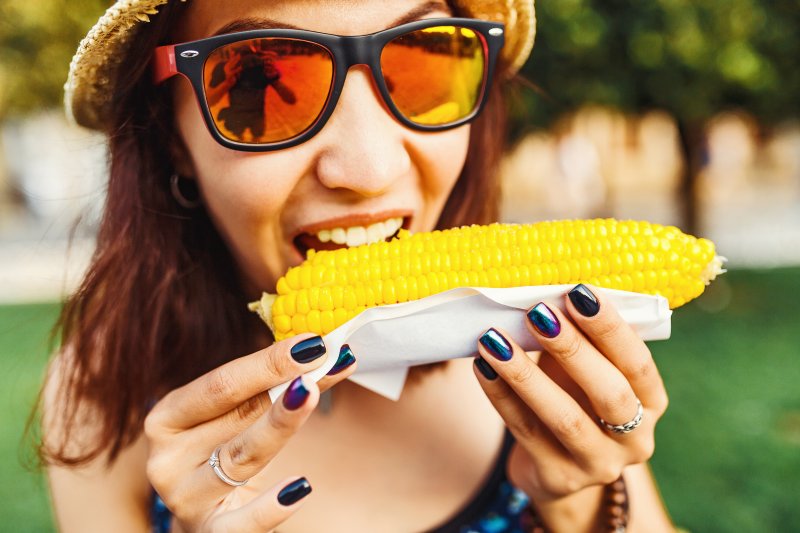 person eating corn on the cob